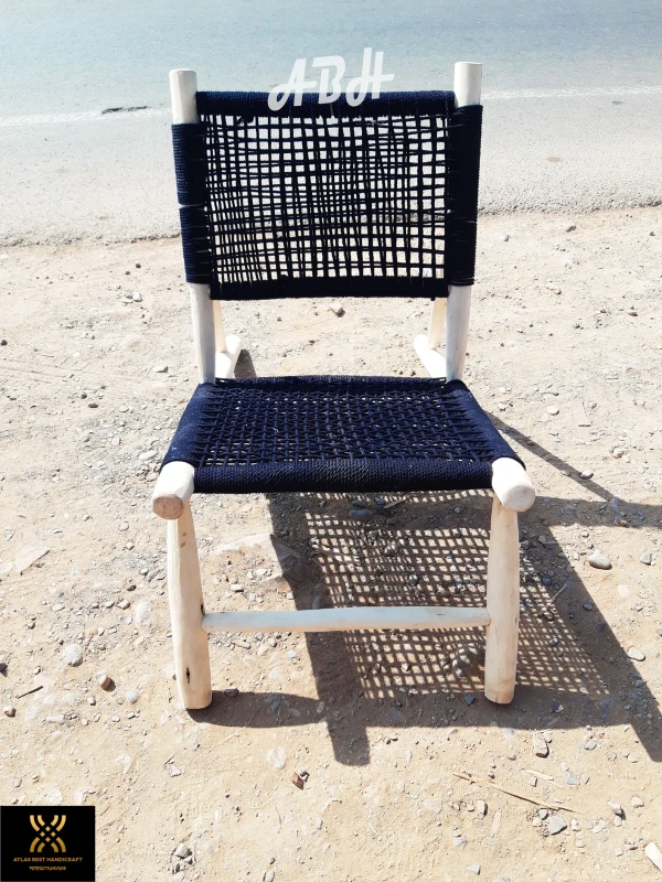 Moroccan armchair handcrafted in wood seated in Macrame